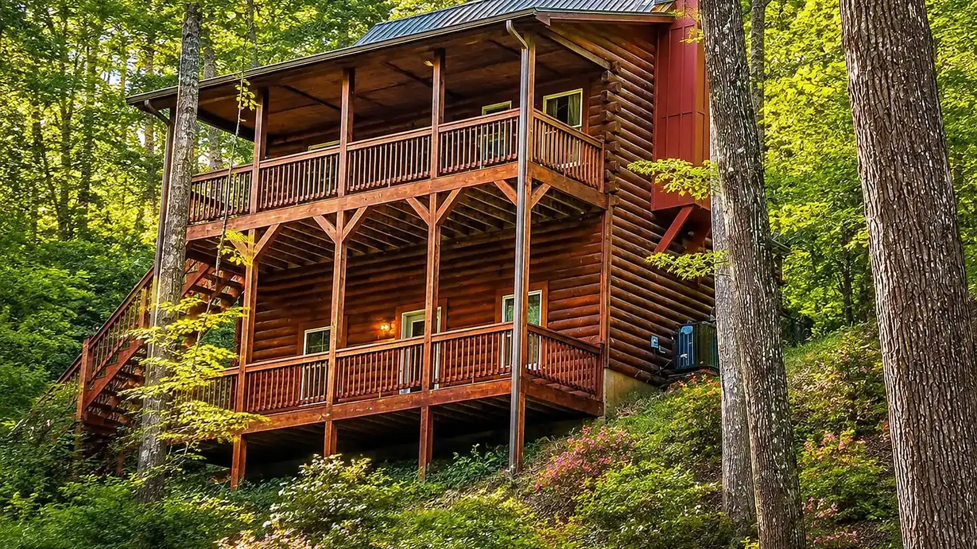 Alpenhaus Cabin exterior surrounded by wooded hillside
