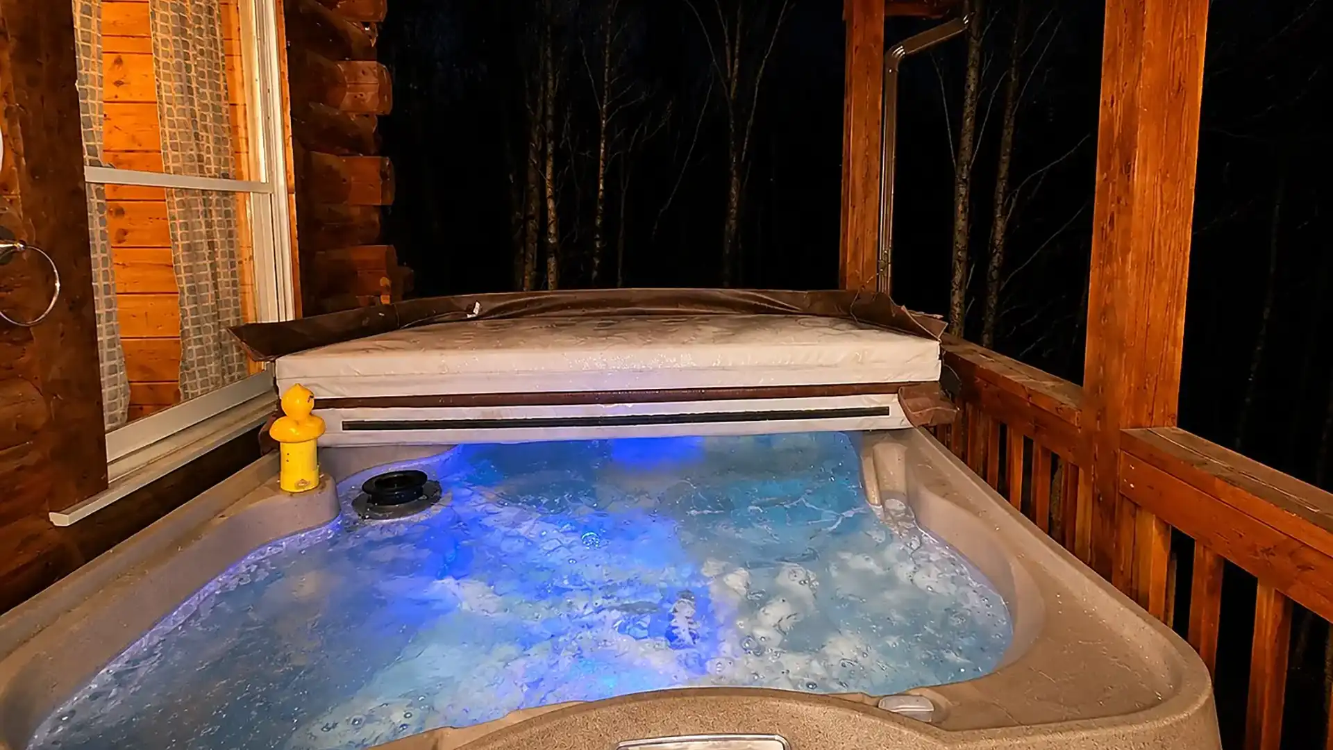 Hot tub bubbling on the deck at night