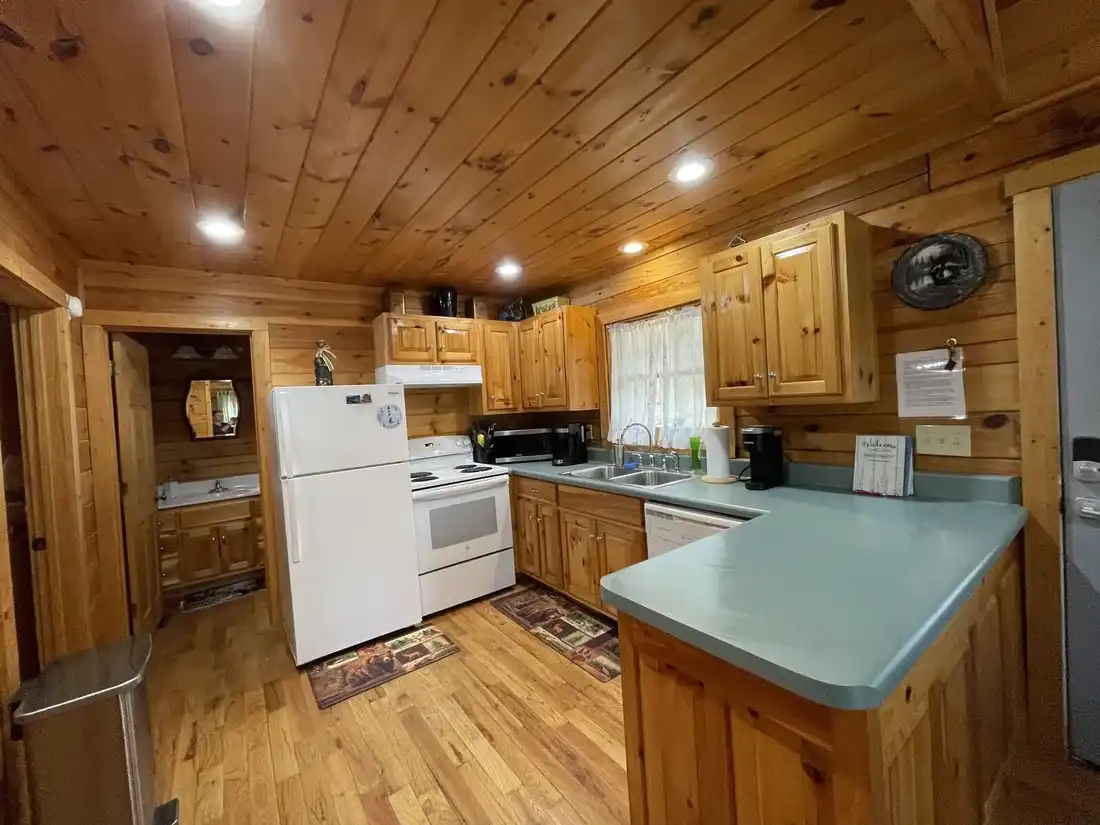 Fully equipped kitchen with wood cabinets